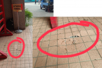 中廊入口附近地板磁磚鼓起破裂